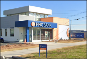 White, blue and orange building used for banking