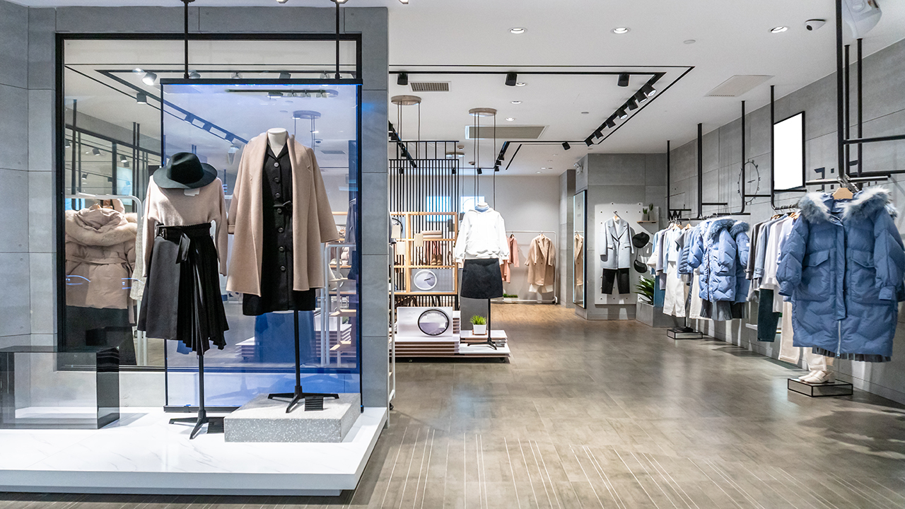 Inside a retail store with clothes on mannequins 